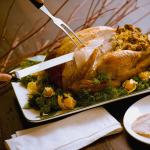 Roast Turkey on a platter being carved.