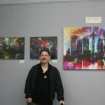 Catherine Krummey/staff photo                                Artist David Baker poses with some of his pieces on display in the Museum of Special Art&rsquo;s &ldquo;Colors of My World&rdquo; exhibit.