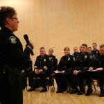 Redmond Police Department Chief Kristi Wilson, left, addresses the crowd &mdash; which featured five other Eastside police chiefs in the foreground &mdash; during Tuesday night&rsquo;s Eastside Muslim Safety Forum at the Muslim Association of Puget Sound in Redmond. Andy Nystrom, Redmond Reporter