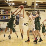 Photo courtesy of Don Borin/Stop Action Photography                                Redmond Mustangs sophomore Kiki Milloy, left, grabs a rebound against the Bellevue Wolverines on Jan. 23. The Wolverines defeated the Mustangs 57-47.