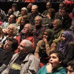 Hundreds of residents attended the community meeting Sunday, filling Sammamish High School&rsquo;s auditorium beyond capacity. Here, the crowd listens to the fire and police chiefs recount the arson (Allison DeAngelis/staff photos).