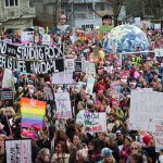 Marchers gather in Judkins Park to listen to speeches before marching to Seattle Center (Allison DeAngelis/staff photo).