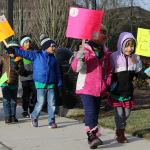 Two female Cedar Crest Academy students walk during their second annual Peace March on Jan. 13 (Allison DeAngelis/staff photo).