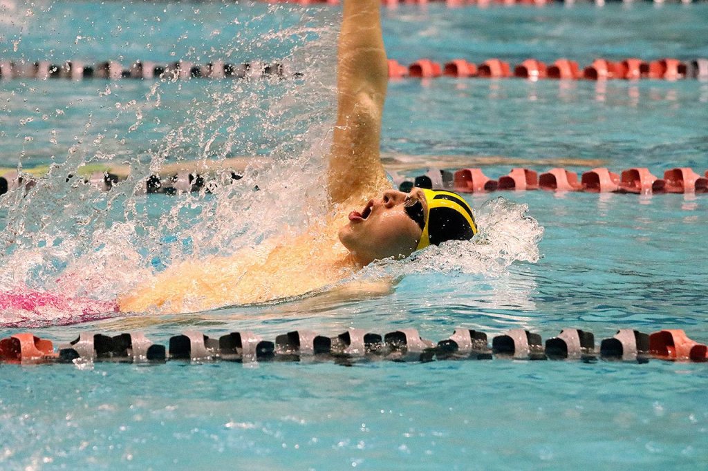 Bellevue&rsquo;s Thomas Eggenberger competes in the 100 back. Eggenberger placed second, finishing in 51 seconds flat (Joe Livarchik/staff photo).