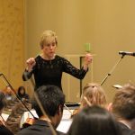 &ldquo;[Christine] is an empire builder. She&rsquo;s hugely collaborative. She surrounds herself with people who can contribute,&rdquo; Newport High School Principal Dion Yahoudy said of the orchestra teacher, shown here conducting the students during practice (Allison DeAngelis/staff photo).