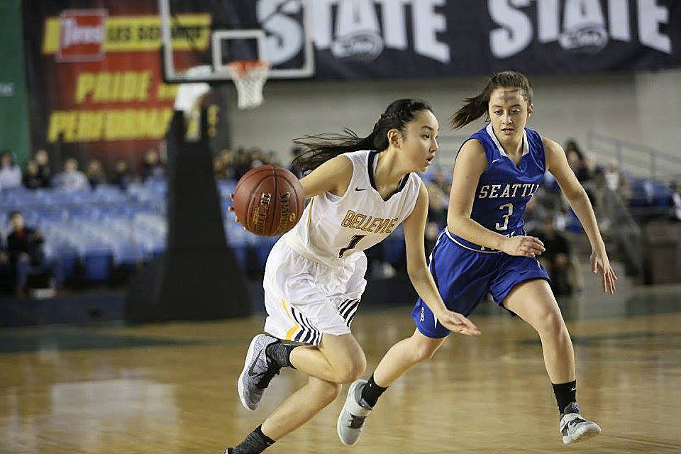 Photo courtesy of Don Borin/Stop Action Photography                                Bellevue Wolverines guard Kara Choi, left, makes a move toward the basket while being guarded by Seattle Prep Panthers player Hilary Lapke. Seattle Prep earned a 58-43 victory against Bellevue in a loser-out Class 3A girls state basketball playoff game on March 1 at the Tacoma Dome. The Wolverines finished the 2016-17 season with an overall record of 21-5.