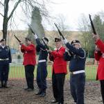Veterans and Leathernecks forming an honor guard fire rifles in honor of Clarence Oscar Johnson, Victor Hanson and Victor Freed. The three lost their lives in the First World War.