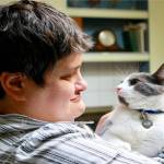 Melissa Maslan and Diesel, her niece&rsquo;s cat, are happily reunited after a few days of not seeing one another at her family&rsquo;s Bellevue home. Maslan, a 48-year-old developmentally disabled woman, has a contagious, enthusiastic personality, her co-workers say. Photo courtesy of Regina Friedland