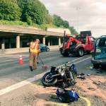 A worker cleans up debris after a motorcyclist died in a collision on Monday on Interstate 5. Photo courtesy of the Washington State Patrol