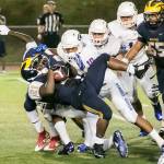 A Bellevue Wolverines running back gets tackled during the season opener in 2015 against Bishop Gorman (Las Vegas) in a non-league contest. File photo