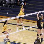 Photo courtesy of Jim Nicholson                                Bellevue outside hitter Callie Weber, left, spikes the ball ferociously against the Mercer Island Islanders in a matchup between KingCo 3A powerhouse programs. Mercer Island defeated Bellevue 3-1 (25-23, 26-24, 17-25, 25-21) on Sept. 20.