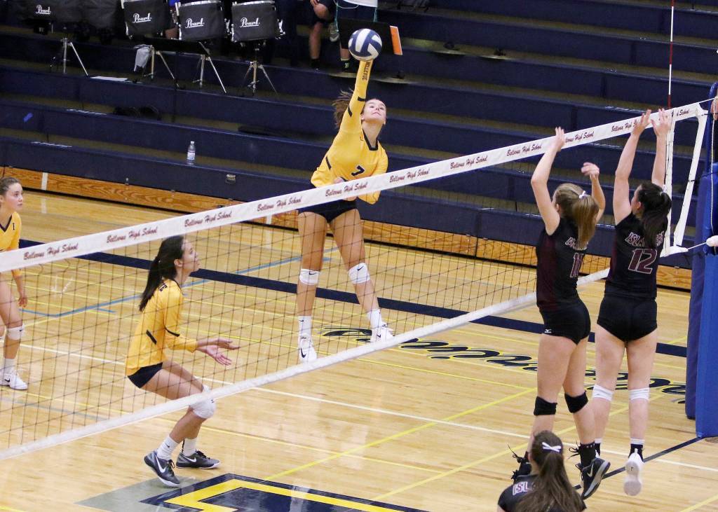 Photo courtesy of Jim Nicholson                                Bellevue outside hitter Callie Weber, left, spikes the ball ferociously against the Mercer Island Islanders in a matchup between KingCo 3A powerhouse programs. Mercer Island defeated Bellevue 3-1 (25-23, 26-24, 17-25, 25-21) on Sept. 20.