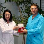 Bellevue teachers Melissa Baker and Jake Nonis demonstrate a chemical experiment. The two are among a team that will launch the first Beakers and Booze event on Oct. 21.                                 Jon Ladd/staff photo