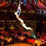 Performers fly through the Teatro ZinZanni spiegeltent. Courtesy of Mark Kitaoka