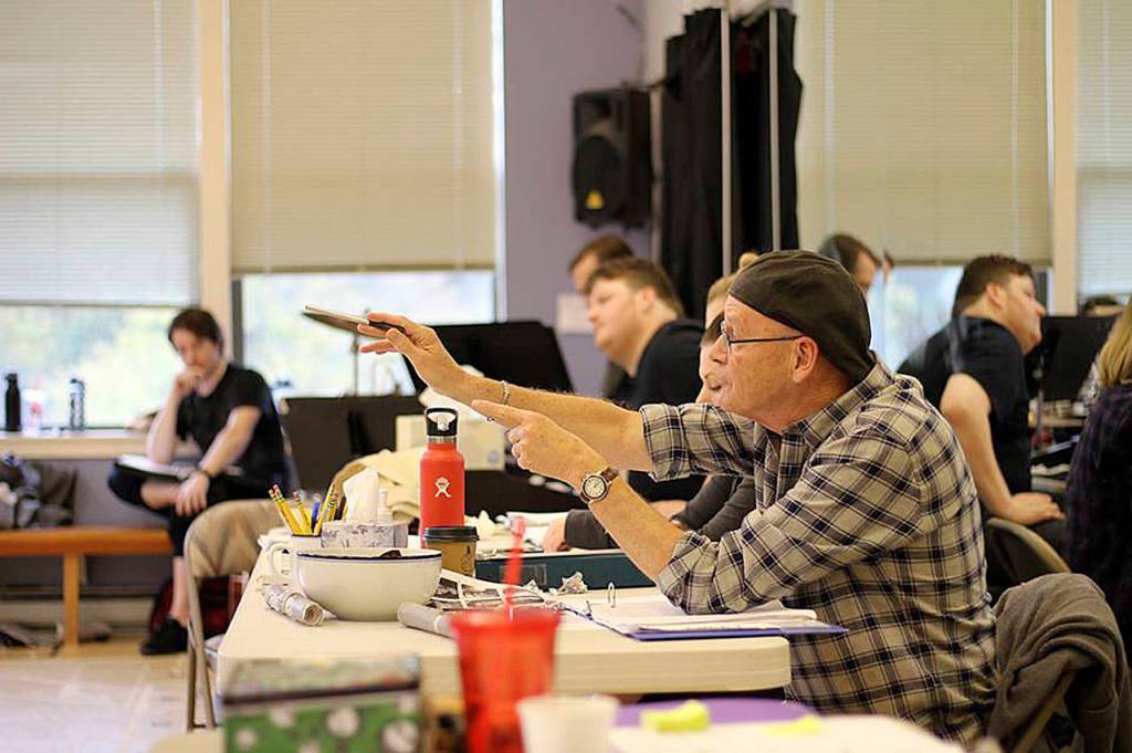 Photo courtesy of Village Theatre                                Director Steve Tomkins guides the Newsies at rehearsal two weeks before opening night.