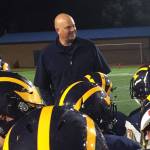 Shaun Scott, staff photo                                Bellevue Wolverines head football coach Mark Landes congratulates his team following their convincing 45-13 triumph against the Lake Washington Kangaroos in the final regular season home game of the 2017 season on Oct. 27 at Bellevue Memorial Stadium.