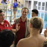 Photo courtesy of James Liu                                Newport Knights boys water polo head coach Farrah Kunkel, left, speaks to her team during the regional tournament on Nov. 4 at Rogers High School in Puyallup.