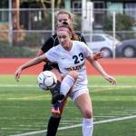 Photo courtesy of Rick Edelman/Rick Edelman Photography                                Bellevue Wolverines senior captain Kiley Suter, right, battles with a Kamiakin player for possession of the ball in the Class 3A state third/fourth place matchup on Nov. 18 at Sparks Stadium in Puyallup.