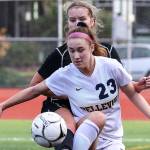 Photo courtesy of Rick Edelman/Rick Edelman Photography                                Bellevue Wolverines senior captain Kiley Suter, right, battles with a Kamiakin player for possession of the ball in the Class 3A state third/fourth place matchup on Nov. 18 at Sparks Stadium in Puyallup.