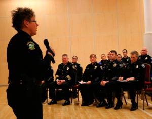 Redmond Police Department Chief Kristi Wilson, left, addresses the crowd  which features five other Eastside police chiefs in the foreground  during an Eastside Muslim Safety Forum at the Muslim Association of Puget Sound in Redmond last January. File photo