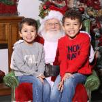 Santa Claus and two youngsters at Country Village. Courtesy of Arthur & Associates