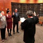 Judge Janet Garrow swore in Bellevue City Councilmembers Conrad Lee, Lynne Robinson and council-elect Jared Nieuwenhuis at a council meeting on Monday. Photo courtesy of city of Bellevue