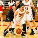 Photo courtesy of Rick Edelman/Rick Edelman Photography                                Newport Knights junior guard Nicole Chan, center, scored a game-high 21 points against the Eastlake Wolves on Dec. 8 at Newport High School in Factoria. Eastlake defeated Newport 70-52.