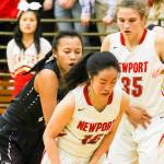 Photo courtesy of Rick Edelman/Rick Edelman Photography                                Newport Knights junior guard Nicole Chan, center, scored a game-high 21 points against the Eastlake Wolves on Dec. 8 at Newport High School in Factoria. Eastlake defeated Newport 70-52.