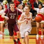 Photo courtesy of Rick Edelman/Rick Edelman Photography                                Newport Knights senior guard David Combs, right dribbles along the baseline against the Eastlake Wolves. Newport improved its overall record to 3-0 with a 43-39 win against Eastlake on Dec. 8 at Newport High School in Factoria.