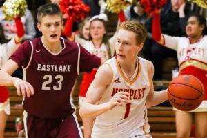 Photo courtesy of Rick Edelman/Rick Edelman Photography                                Newport Knights senior guard David Combs, right dribbles along the baseline against the Eastlake Wolves. Newport improved its overall record to 3-0 with a 43-39 win against Eastlake on Dec. 8 at Newport High School in Factoria.