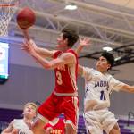 Photo courtesy of Patrick Krohn                                The Newport Knights earned a 60-54 win against the North Creek Jaguars on Dec. 12. Newport guard Elliot Thompson (pictured) drives to the hoop against North Creek. The Knights improved their overall record to 4-1 with the victory.