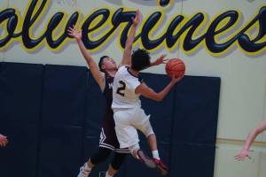 Photo courtesy of Don Borin/Stop Action Photography                                Bellevue junior guard Jalen Love drives to the hoop against the Mercer Island Islanders. Love, who scored 15 points in the game, hit a crucial three-pointer with 5.6 seconds left in regulation.
