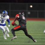 Photo courtesy of Scott Miller                                Sammamish Totems senior Tao McClinton, center, makes a move up the field after making a catch against the Ingraham Rams on Sept. 29. McClinton will continue his football career at Sacramento State University.