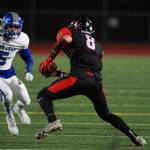 Photo courtesy of Scott Miller                                Sammamish Totems senior Tao McClinton, center, makes a move up the field after making a catch against the Ingraham Rams on Sept. 29. McClinton will continue his football career at Sacramento State University.