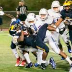 A Bellevue Wolverines running back gets tackled during the season opener in 2015 against Bishop Gorman (Las Vegas) in a non-league contest. File photo