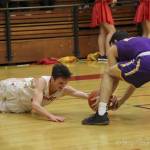 Photo courtesy of Don Borin/Stop Action Photography                                Newport senior guard Elliot Thompson (left) dove for a loose ball against the Issaquah Eagles on Jan. 26 at Newport High School in Factoria. Thompson scored 22 points against Issaquah.