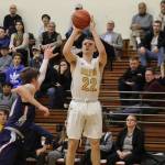 Photo courtesy of Don Borin/Stop Action Photography                                Bellevue Wolverines senior forward Andrew Kenny unleashes a three-point attempt against the Juanita Rebels in the KingCo 3A title game on Feb. 7 at Newport High School in Factoria.
