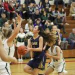 Photo courtesy of Don Borin/Stop Action Photography                                Bellevue Wolverines guard Kara Choi, middle, hit clutch shots from the perimeter throughout the KingCo 3A tournament title game against the Redmond Mustangs on Feb. 7 at Newport High School in Factoria.