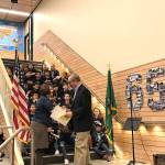 Principal Amy MacDonald accepts a proclamation from Mayor John Chelminiak while the Enatai Choir looks on. Photo courtesy of Lisa Benko