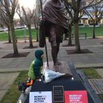 A child at Bellevue Librarys Mahatma Gandi statue during the vigil for the 17 victims of the Parkland, Florida high school shooting. Photo courtesy of Twisha