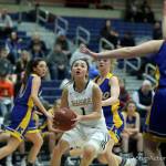 Photo courtesy of Don Borin/Stop Action Photography                                With a berth in the Class 3A state girls basketball tournament on the line, the Bellevue Wolverines delivered against the Kelso Hilanders. The Wolverines earned a 50-33 win against the Hilanders in a winner-to-state, loser-out regional playoff game on Feb. 23 at Bellevue College. Bellevue sophomore guard Kara Choi (pictured) drove to the basket against the interior of the Kelso defense. The Wolverines (21-5) will face the Bethel Braves at 9 a.m. on Feb. 28 in the first round of the Class 3A state tournament at the Tacoma Dome.