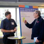 Neighborhood Outreach Manager Mike McCormick-Huentelman speaks with Bellevue resident Richard Morris about what should be included in a neighborhood plan. Evan Pappas/Staff Photo