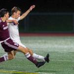Photo courtesy of Patrick Krohn/Patrick Krohn Photography                                 Mercer Island player Alex Platou, left, and Interlake defender Charlie Myhran, right, battle for possession of the ball in the first half of play on April 11 at Interlake High School in Bellevue. Mercer Island defeated Interlake 2-1 in the contest.