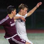 Photo courtesy of Patrick Krohn/Patrick Krohn Photography                                Mercer Island player Alex Platou, left, and Interlake defender Charlie Myhran, right, battle for possession of the ball in the first half of play on April 11 at Interlake High School in Bellevue. Mercer Island defeated Interlake 2-1 in the contest.