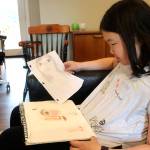 Megan with some of her recent artwork. Raechel Dawson/staff photo