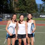 Photo courtesy of Matthew Perlman                                Interlake Saints singles player Addie Eklund, left, won the KingCo 3A singles tournament at Mercer Island High School on May 4. The doubles duo of Olivia Sun (center) and Sylvia Eklund (right) captured the KingCo 3A doubles tournament championship.