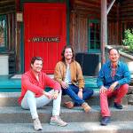 New owners of Central Whidbeys historic Captain Whidbey Inn are, from left, Matt French, his brother, Mike, and Eric Cheong. The three take a break on the inns porch. (Photo by Rick Chapman)