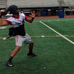 Coby Akana unleashes a pass deep down the sideline to one of his receivers during a spring football practice session on June 8 at Sammamish High School in Bellevue. Shaun Scott, staff photo