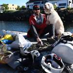 R2AK entrant Josh Collins of Merritt Island, Fla., is Team Torrant, a stand-up paddleboarder who plans to go all the way to Ketchikan while raising awareness of traumatic brain injuries and PTSD in veterans. Collins is with his therapy dog Charlie who wont be going along for the ride. The race begins Thursday at 5 a.m. from the Port Townsend waterfront. (Jeannie McMacken/Peninsula Daily News)