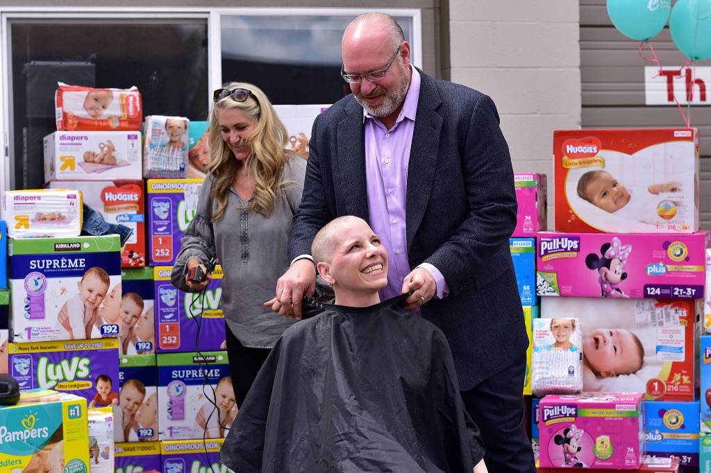 Erin Hansmans head is officially shaved and she is all smiles. Photo courtesy of Eastside Baby Corner
